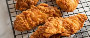 Crispy Copycat Raising Cane’s Chicken tenders with dipping sauce and fries