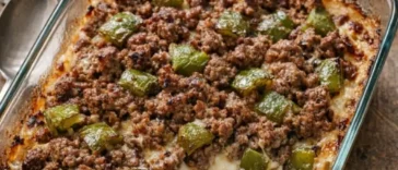 Oven-baked Amish beef and bell pepper casserole in a white baking dish, fresh from the oven