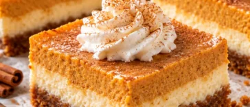 Pumpkin Cheesecake Bars with Cinnamon Cream